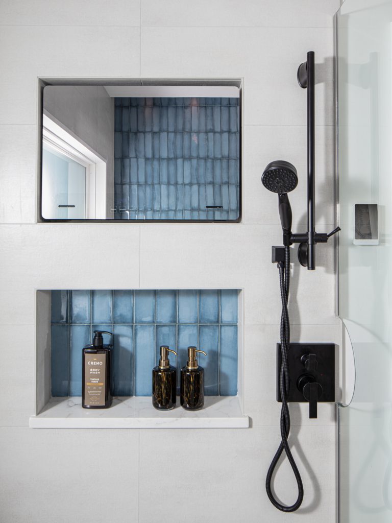 Shower with TV and blue tile